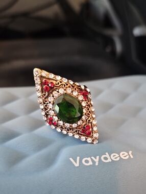 Gold-Tone Ring with Green Center Gem and Red Accents